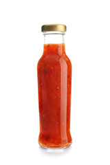 Bottle with tasty sauce on white background