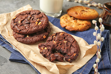 Tasty chocolate cookies on grey table