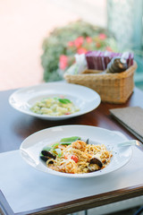 Spaghetti pasta with seafood - mussels and shrimps at italian food restaurant.
