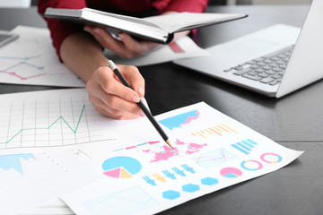 Successful businesswoman working in office, closeup