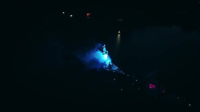 Aerial shot: Night action. A scene of recognition in love, a request of the hand and heart on the ship
