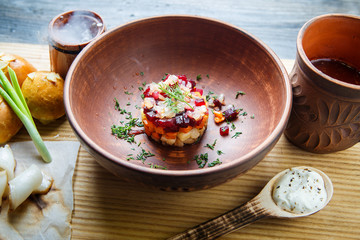 wooden table topped with plates of traditional ukrainian food
