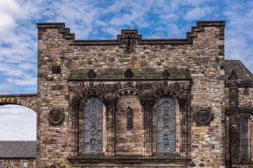 Fototapeta na wymiar Edinburgh, Scotland, UK - June 14, 2012: Brown stone facade with windows of Scottish National War Memorial at Castle.