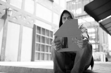 Homeless man and his cardboard house