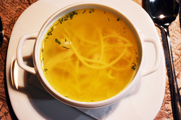 Chicken broth in a white plate