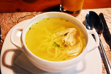 Chicken broth in a white plate