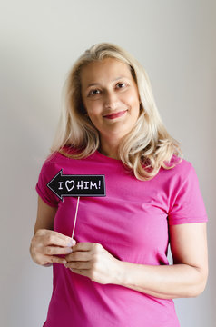 Woman holding photo prop with love massage