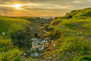 Plastics garbage on beach. Reduce Reuse Recycle. Environmental marine pollution. Waste rubbish from...