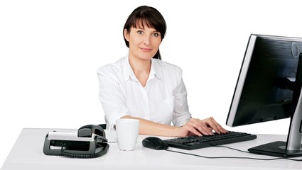 Woman typing on office computer
