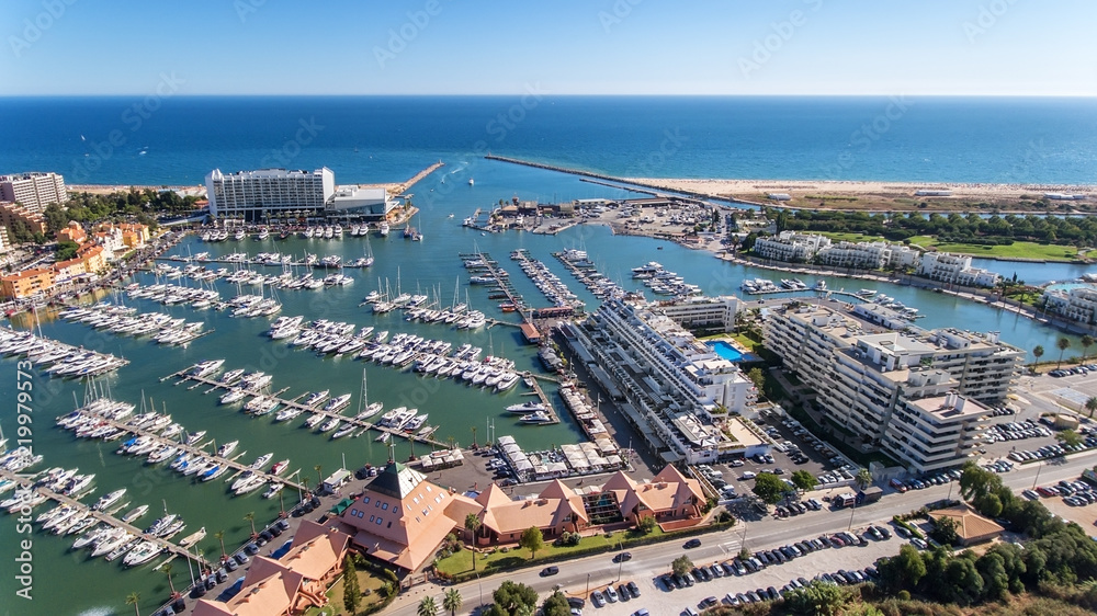 Wall mural Aerial view of the bay of the marina, with luxury yachts in Vilamoura.