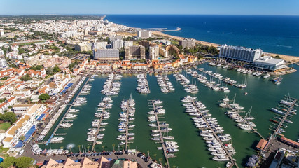Obraz premium Aerial view of the bay of the marina, with luxury yachts in Vilamoura.