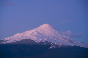 Sunset with a view of a volcano