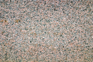 Image of a granite wall as a backdrop.