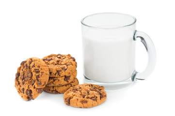 Chocolate cookies close up and cup of milk on white background