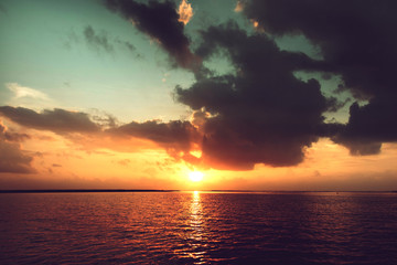Fototapeta na wymiar dark silhouettes and amazing cloudy sky on sea sunset at tropical island in Thailand