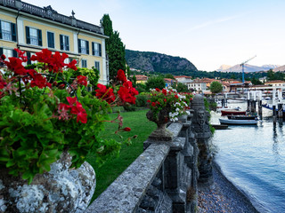 terrace with flower pots on the lakeside.Como Lake, Italy