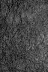 Naklejka premium black crumpled paper texture background handmade