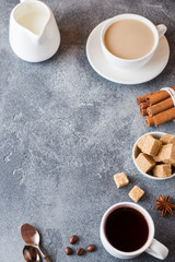 Cup of coffee, brown sugar and cinnamon with anise on concrete background. Copy space