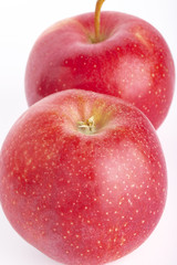 red ripe apples on a white background