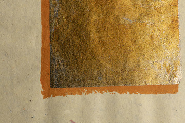gold orange painted texture on nature paper