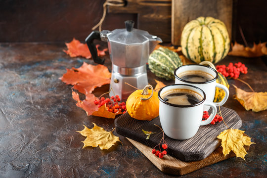 Coffee cups and pumpkins