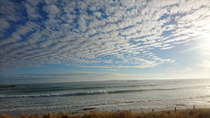 Scattered Clouds Over the Sea
