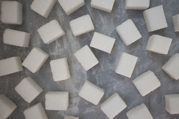 sugar cubes on concrete background. Top view of white sugar . Sugar with copy space. Top view or flat lay
