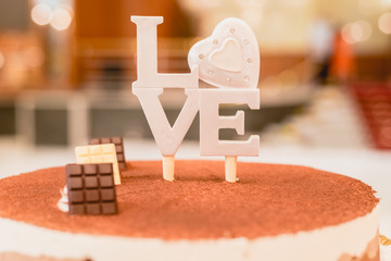 Word Love in wooden letters to decorate a wedding.