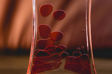 Red drops similar to blood falling in water.