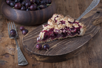 Pie with gooseberry on wooden board © severga