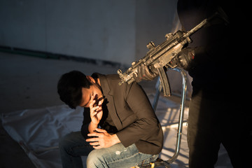 Businessman is hostage from bandit,Thailand people,Hostage of terrorist man concept,silhouette...