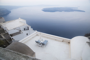 Fototapeta na wymiar White architecture on Santorini island, Greece. Beautiful summer landscape, sea view.
