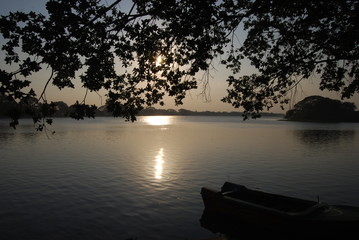 Fisherboat at beautiful sunset on Lake in Sri Lanka