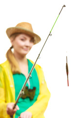 Woman with fishing rod , spinning equipment