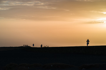 Fototapeta na wymiar 'Mirador del Rio' sunset with a woman,Lanzarote, Spain