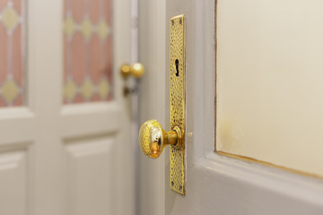 Antique door handle in a retro apartment