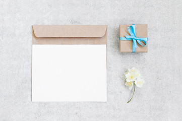 Grey background with blank postcard and envelope