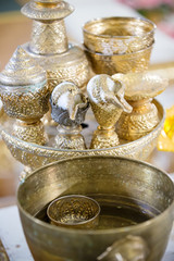 Thai wedding accessory for cultural wedding ceremony, luxury chair for bride and groom, golden tray with pedestal and the others. image for wedding objects, copy space and article.