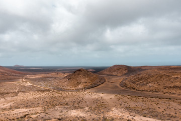 Landscape of volcanic desert of  Lanzarote, Spain - 219997536