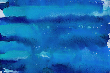 Colorful watercolor ombre leaks and splashes texture on white watercolor paper background. Natural organic shapes and design.