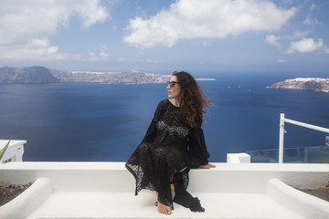 Beautiful woman enjoying her summer holidays in Santorini,Greece.