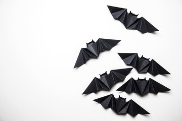Halloween origami paper dracula bats on a white background - obrazy, fototapety, plakaty
