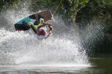 Wakeboarder make a trick on a lake