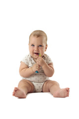 Infant baby brushing milk teeth. Isolated on white background