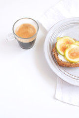 Fresh green figs sandwiches canapes Grey rustic plate Black coffee Espresso Wholegrain bread Goat cheese Healthy eating concept Appetizer Isolated Copy space White background Top view