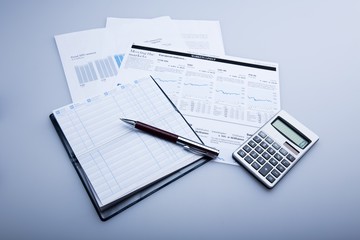 Naklejka na ściany i meble Pen, Balance Book And Calculator On Financial Reports