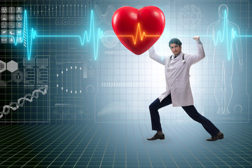 Doctor cardiologist supporting cardiogram heart line