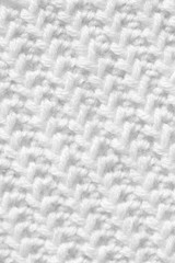 Knitting from woolen threads. Texture for the New Year's postcard. White background for various purposes.