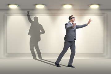 Fototapeta premium Businessman and his shadow in business concept