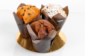 Group of muffin cup cake closeup. With chocolate chips and fruit filling